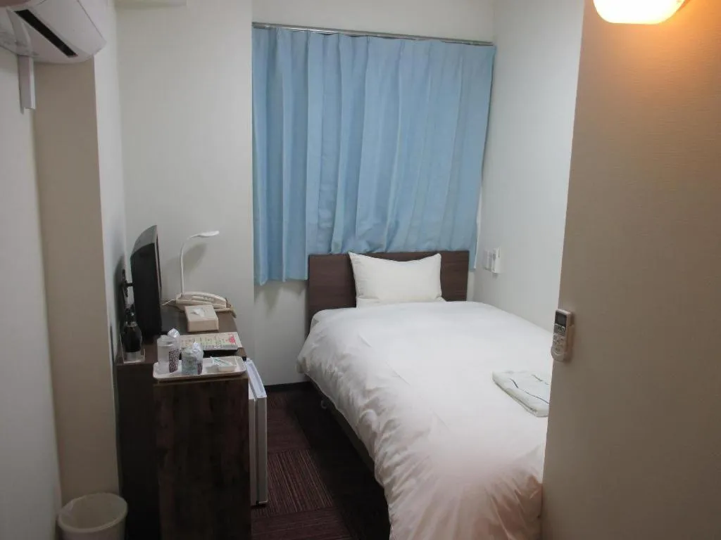 Bed in Ikebukuro Royal Hotel Higashiguchi