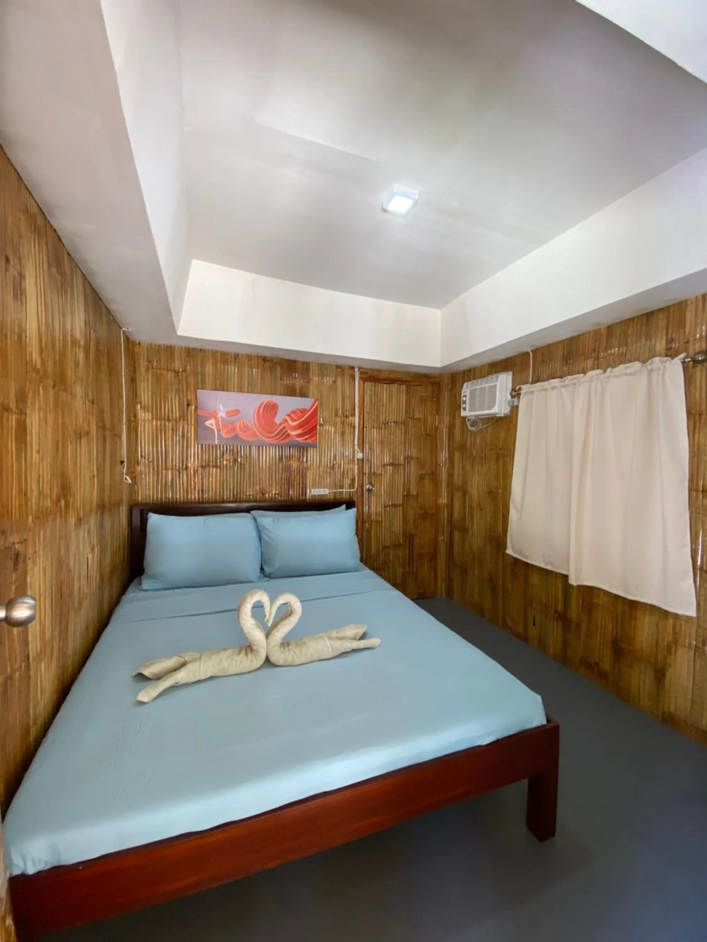 Bed in Moalboal Beach Front Hotel