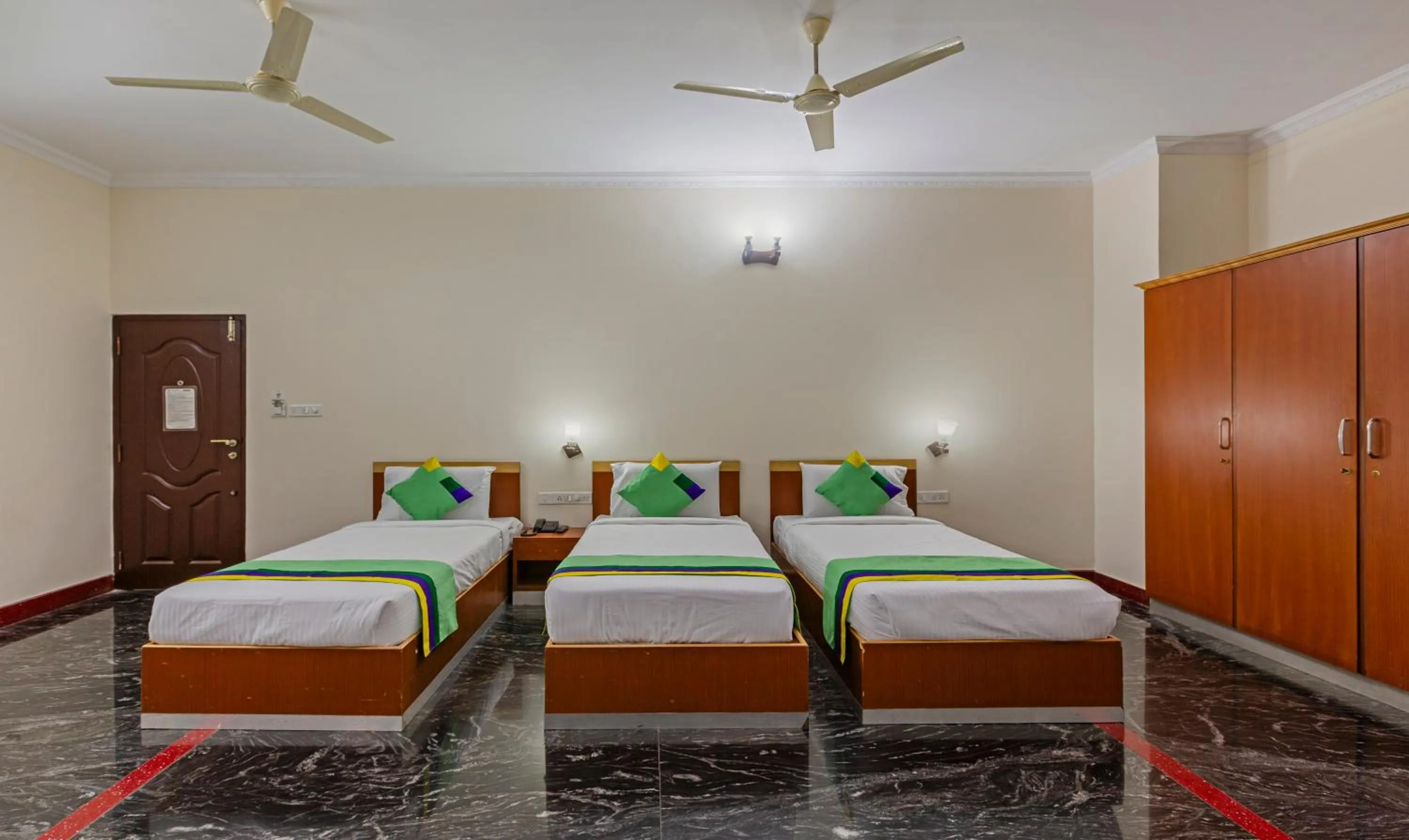 Bed in Treebo Akshaya Residency