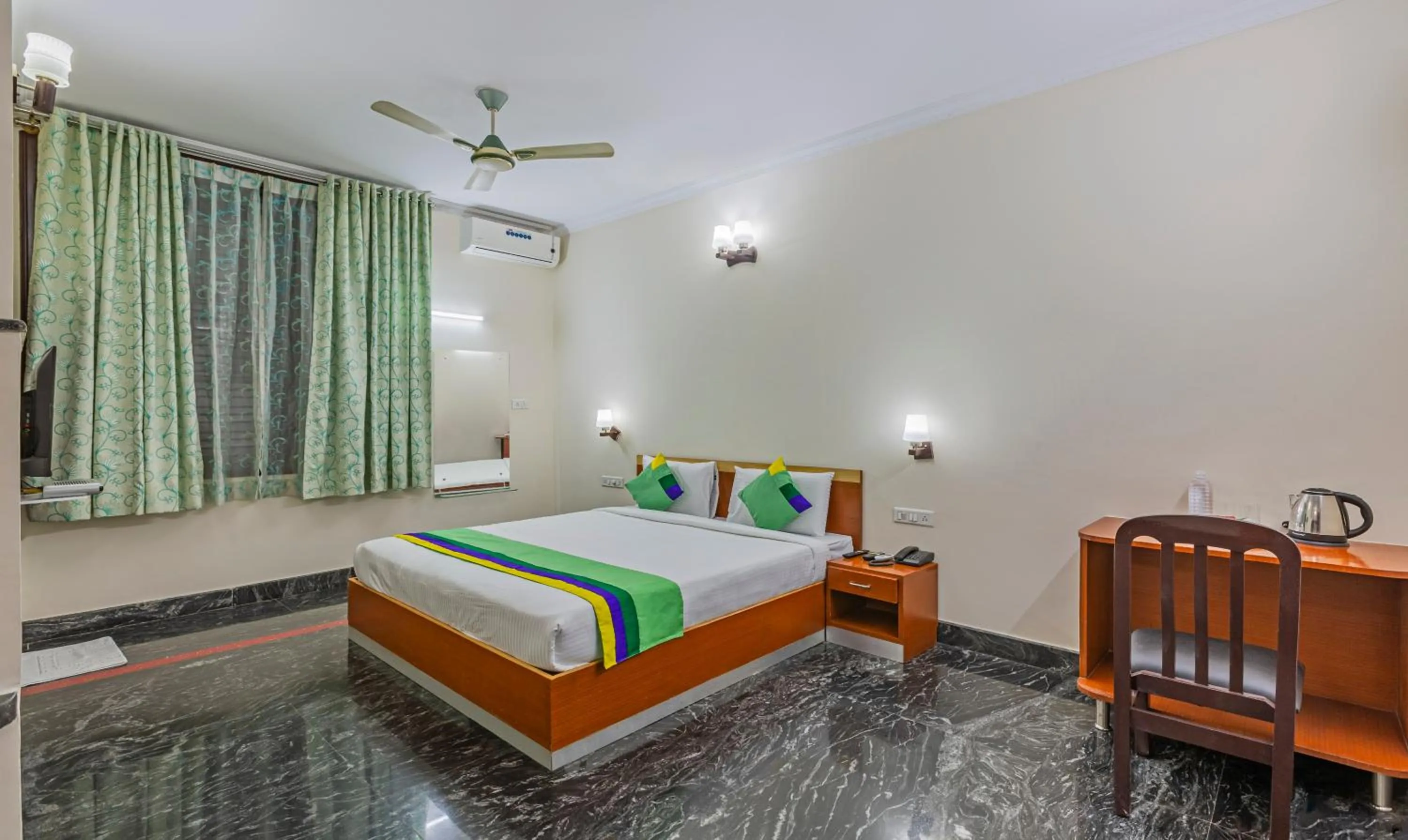 Bed in Treebo Akshaya Residency