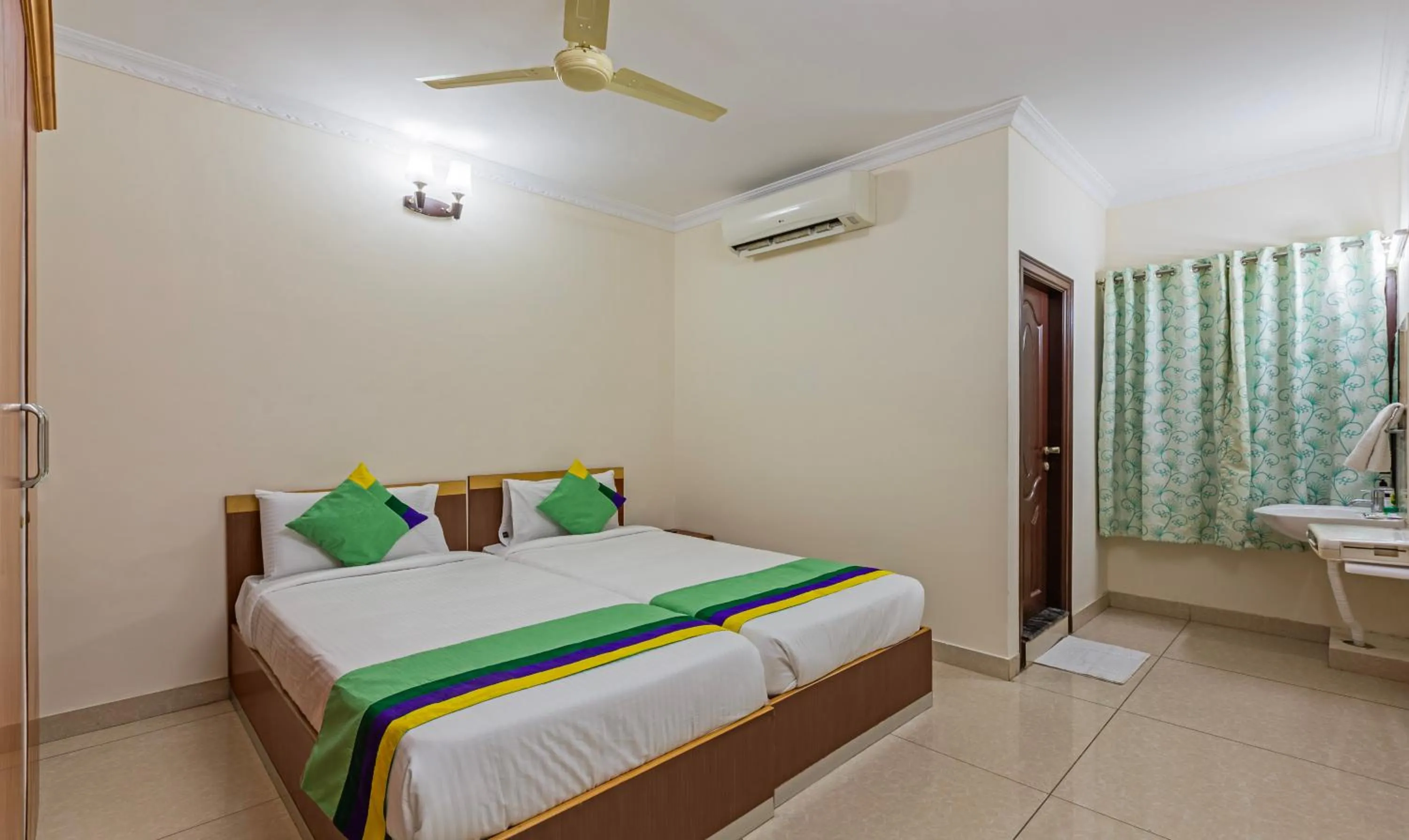 Bed in Treebo Akshaya Residency