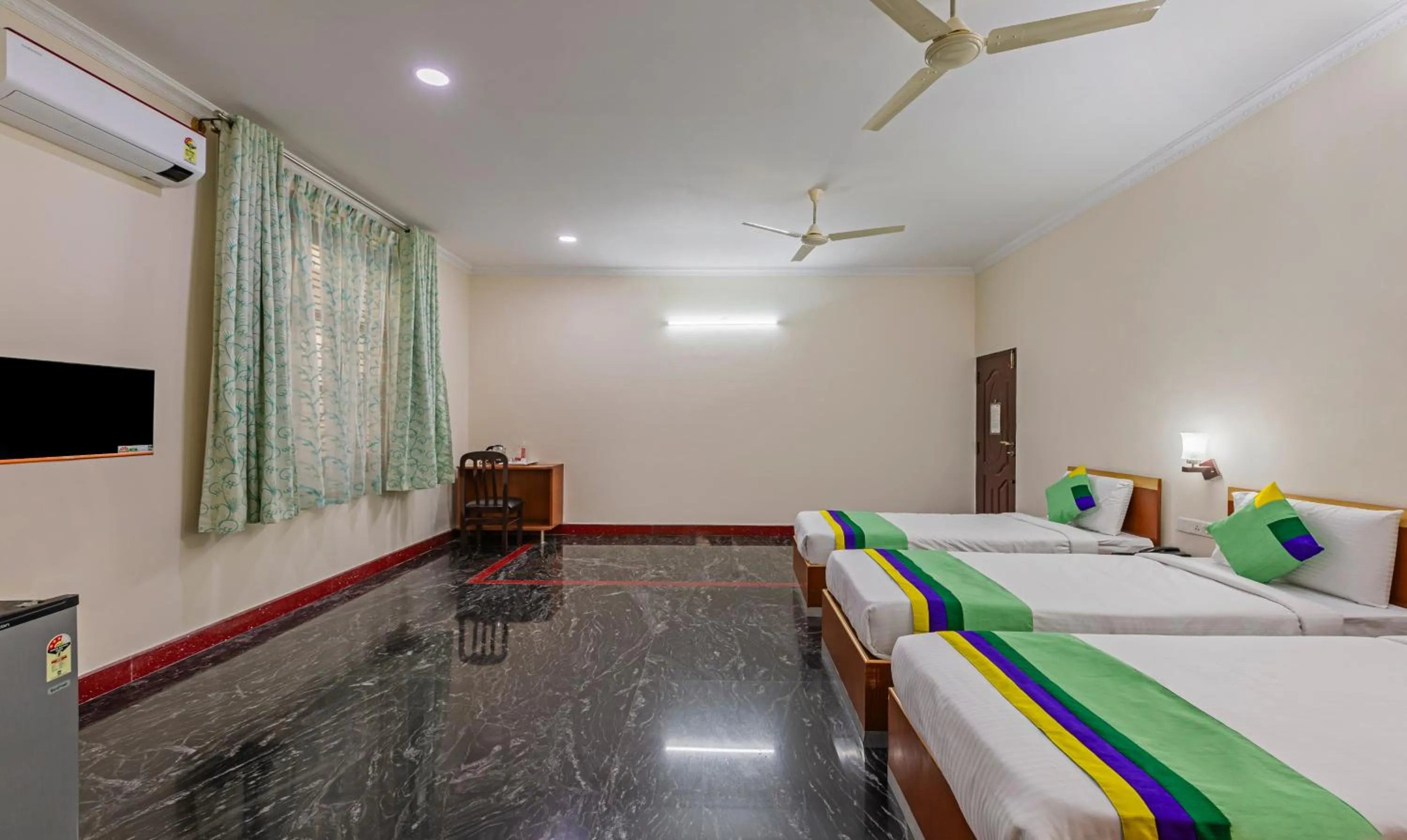 Bed in Treebo Akshaya Residency