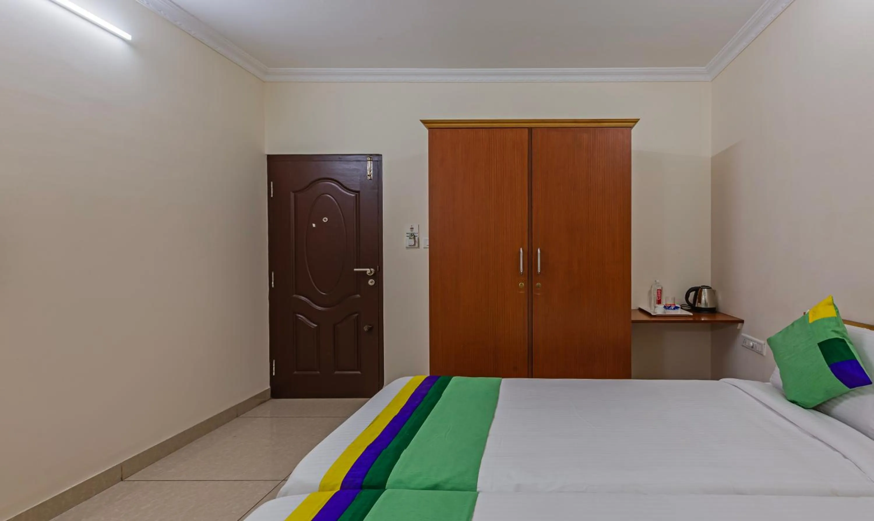 Bed in Treebo Akshaya Residency