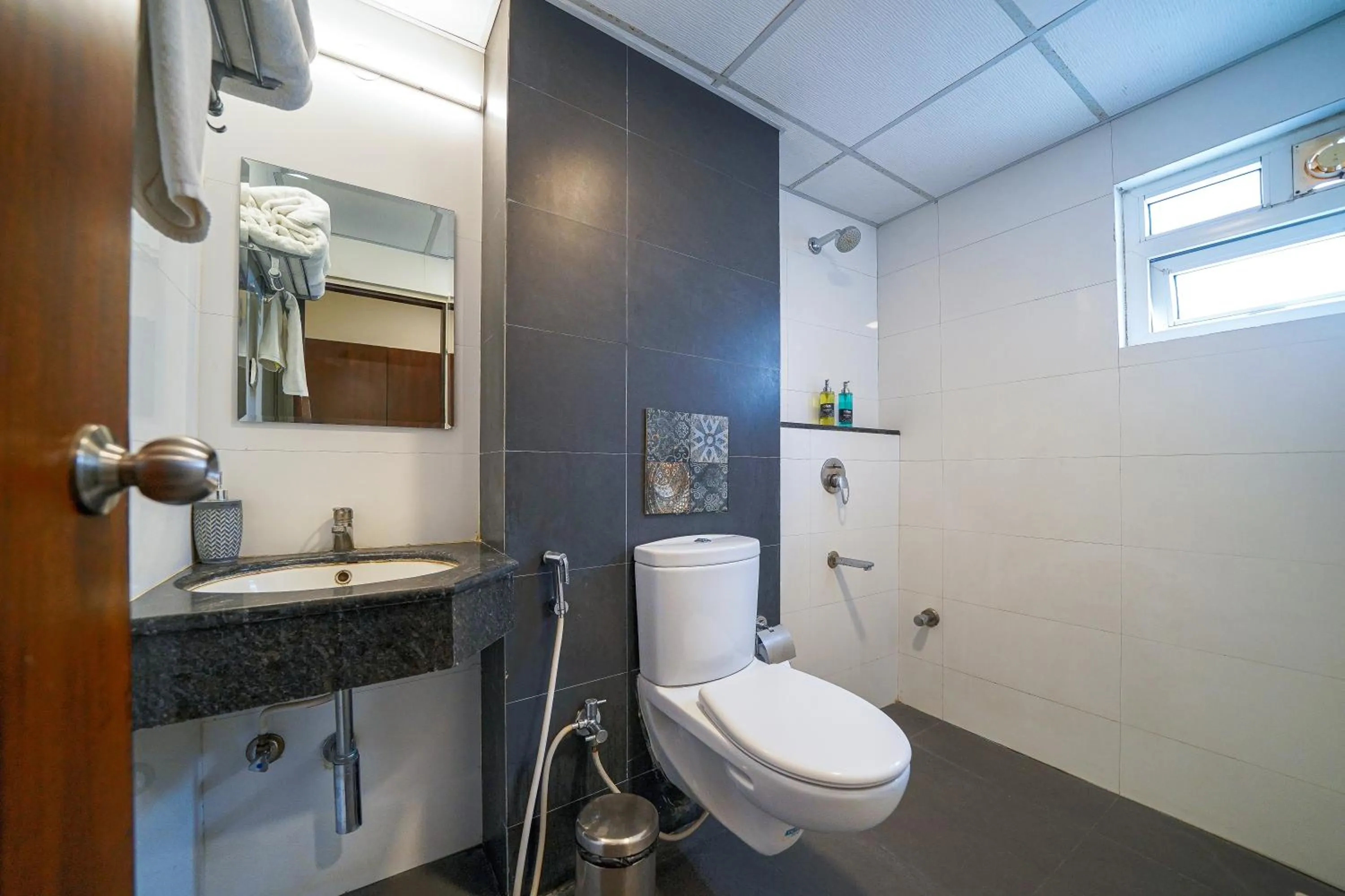 Shower in Olive Hotel Electronic City by Embassy Group