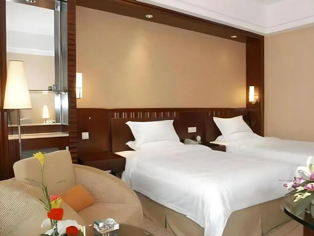 Bed in Shangyu International Hotel
