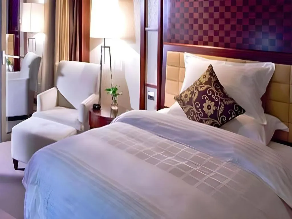 Bed in Shangyu International Hotel