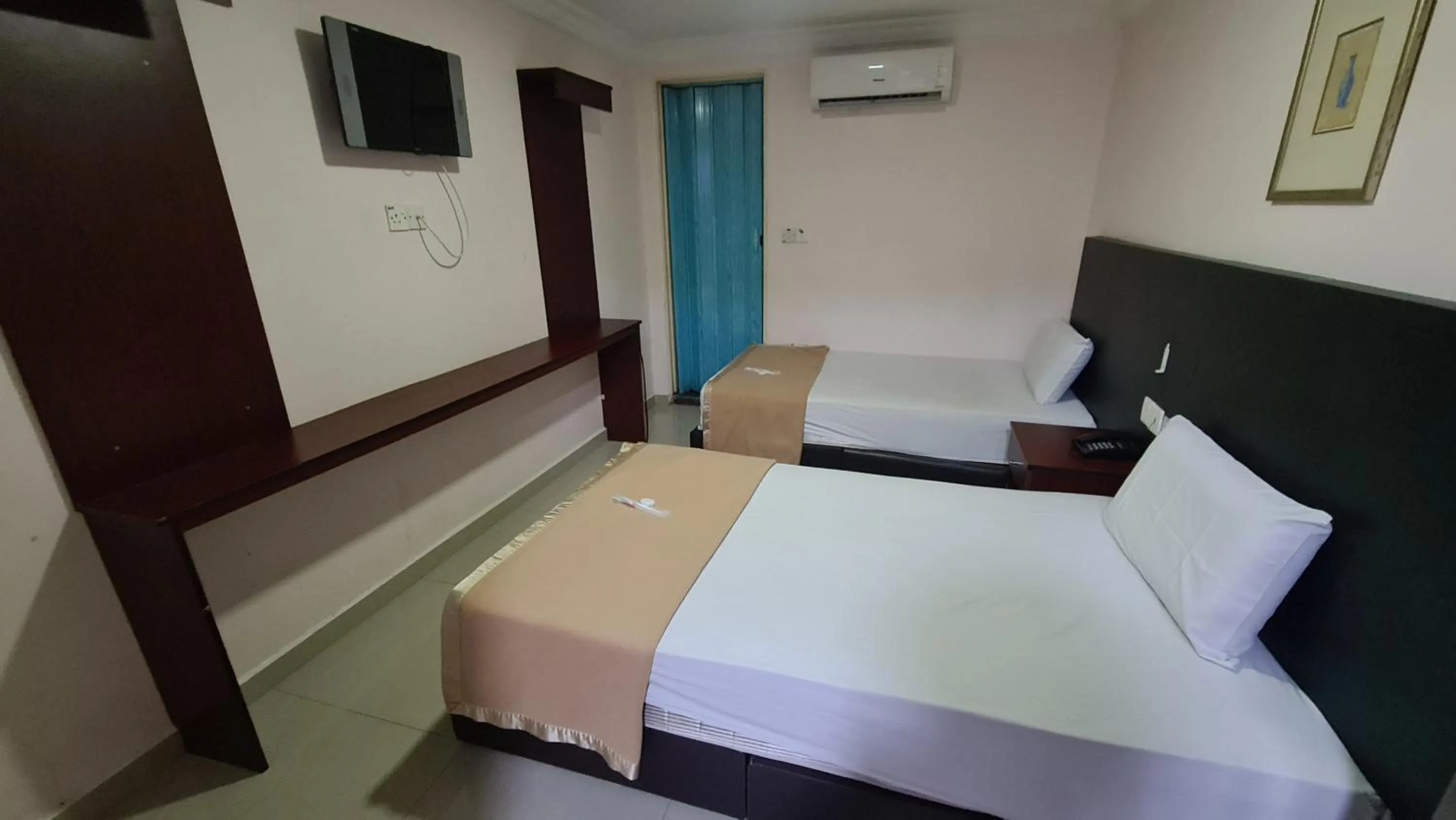 Bed in SP Venture Boutique Hotel