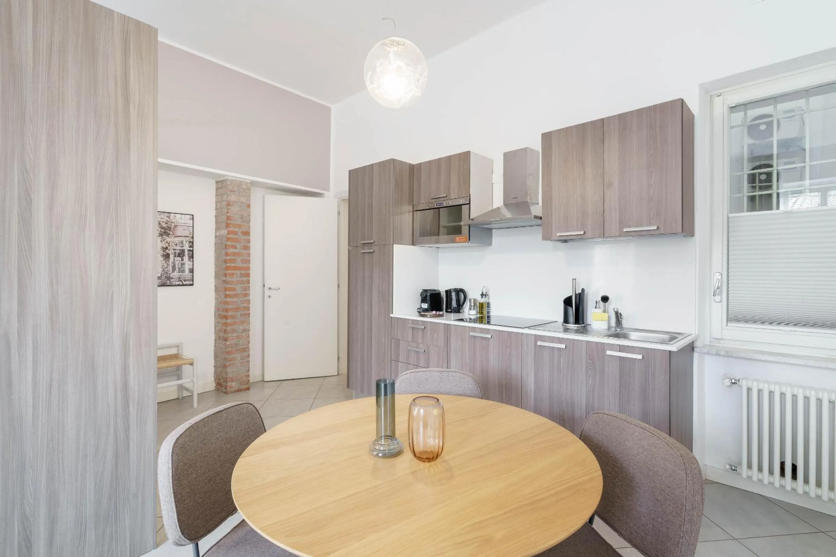 Kitchen or kitchenette in Limehome Verona La Vigna in Città