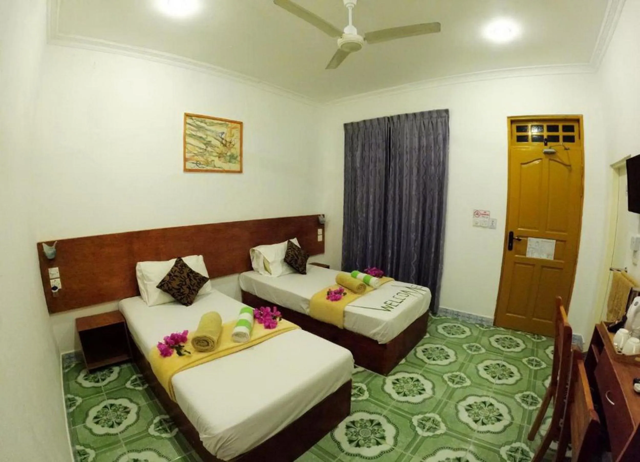 Bed in Adroit Beach Inn