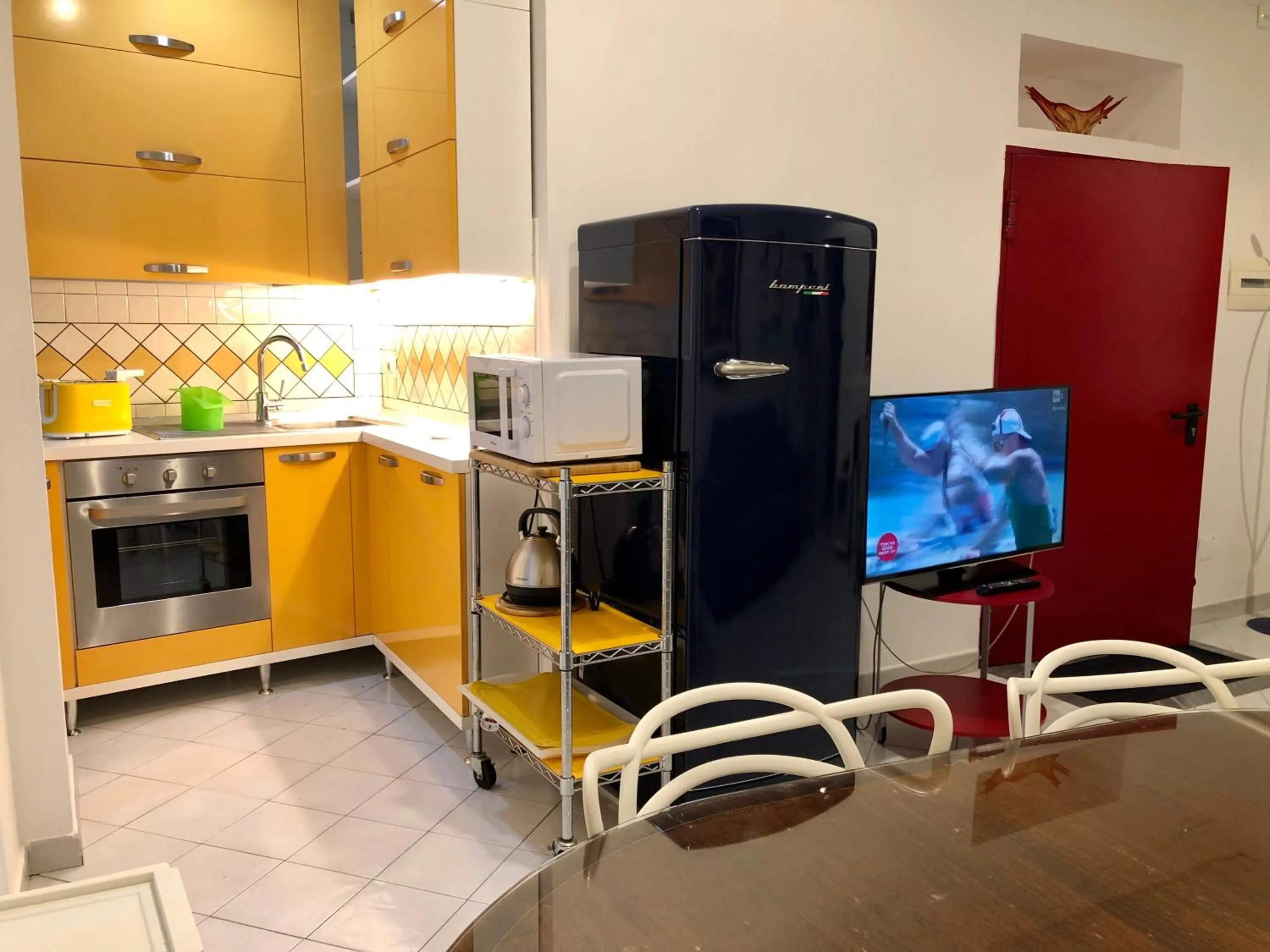 Kitchen or kitchenette in Casa Vittoria