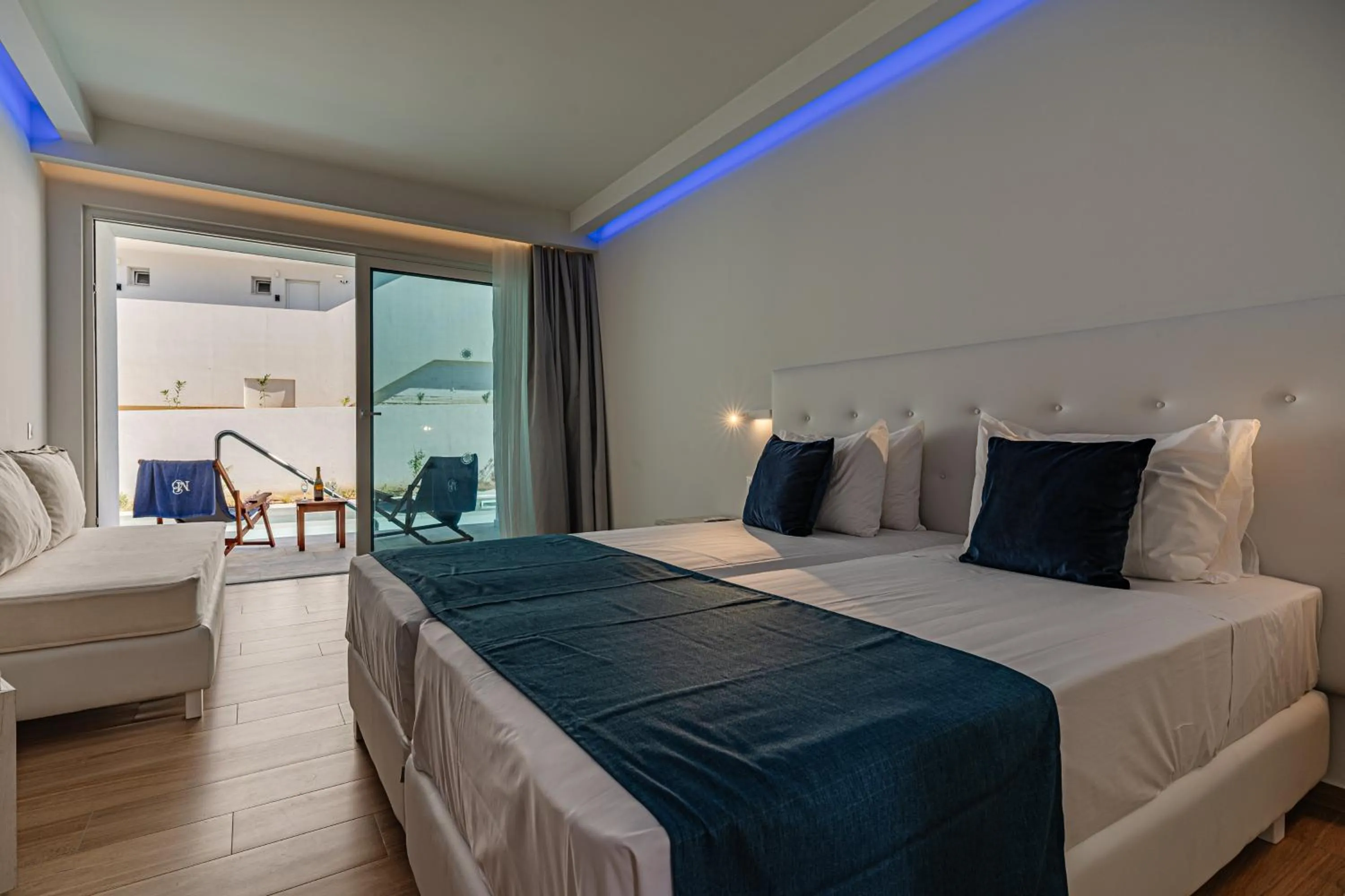 Bed in Magique Bleu Suites