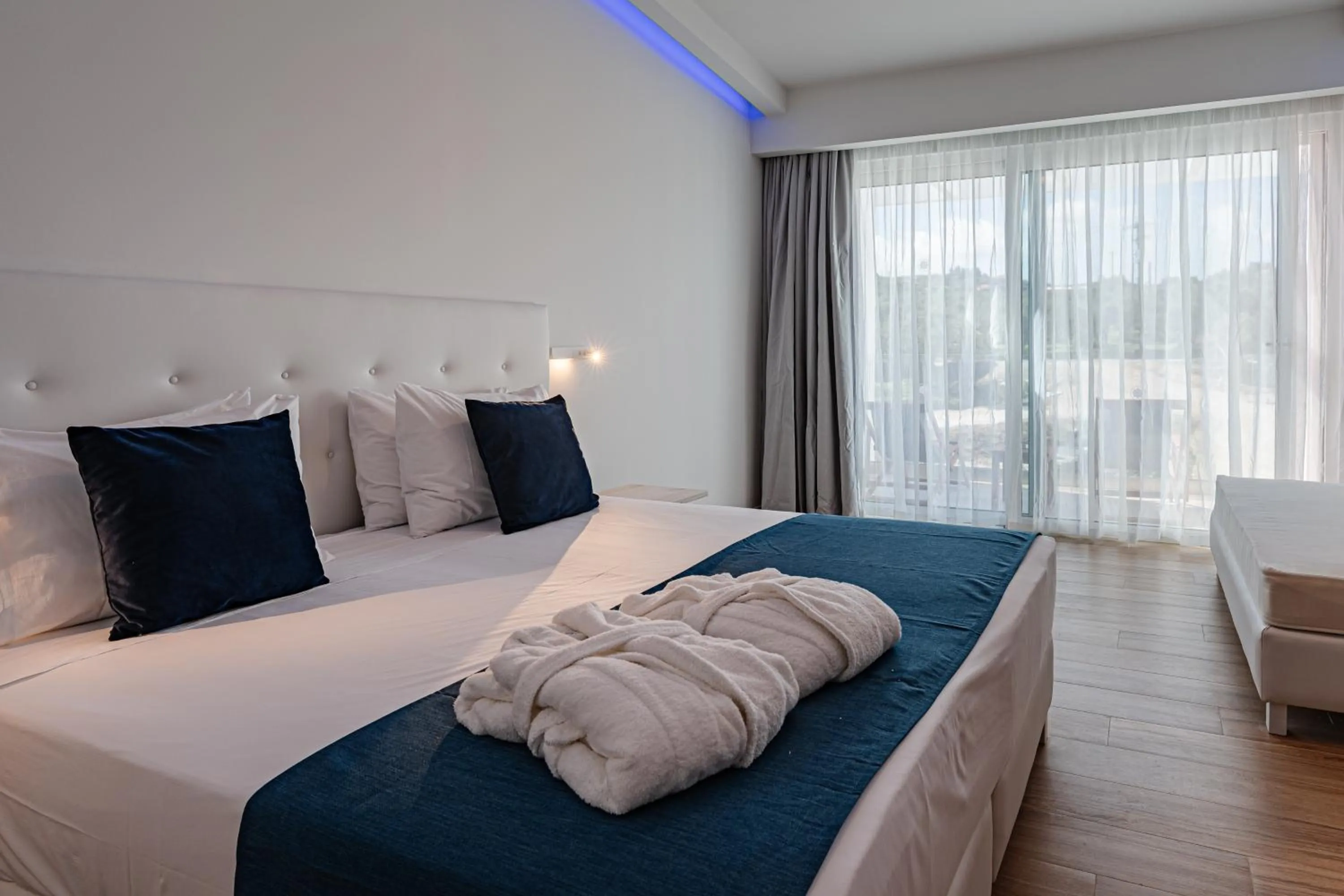 Bed in Magique Bleu Suites