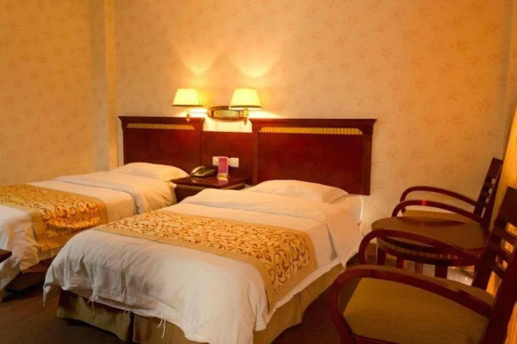 Bed in Nantong GuoDu Hotel