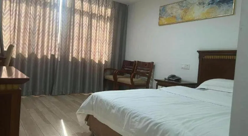 Bed in Nantong GuoDu Hotel