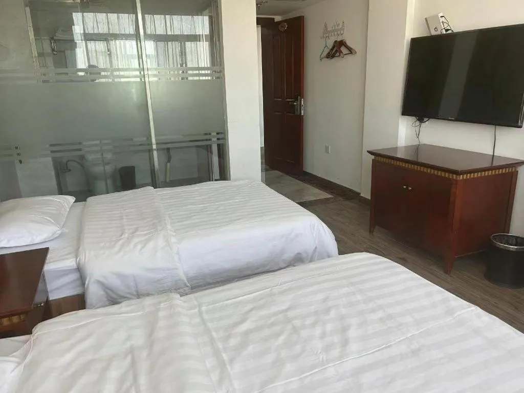 Bed in Nantong GuoDu Hotel