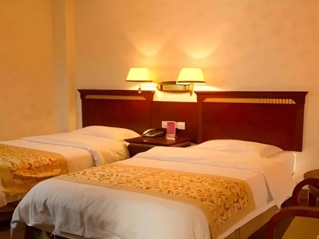 Bed in Nantong GuoDu Hotel