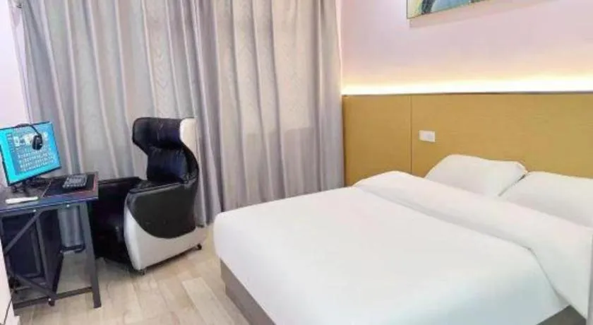 Bed in Nantong GuoDu Hotel