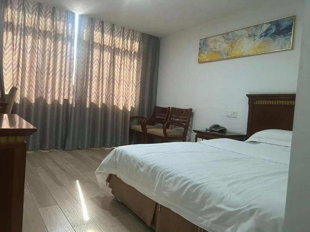 Bed in Nantong GuoDu Hotel