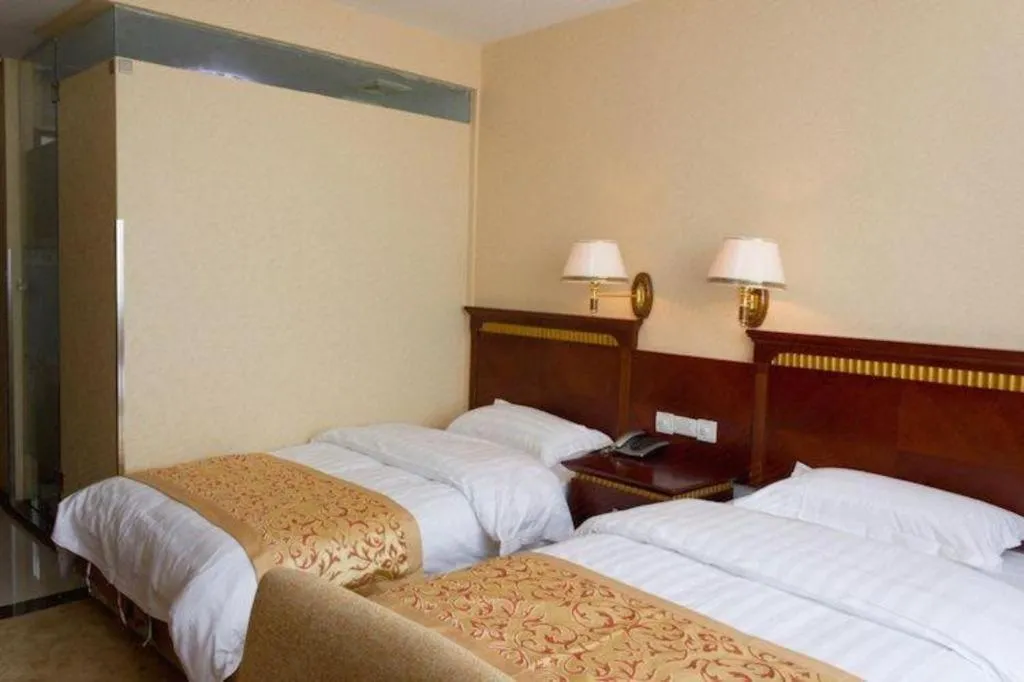 Bed in Nantong GuoDu Hotel