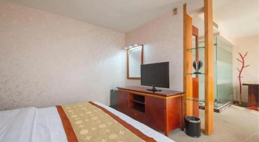 Bed in Nantong GuoDu Hotel