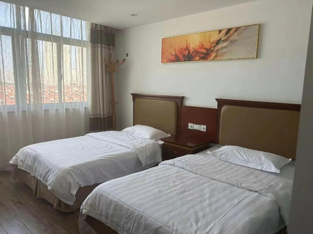 Bed in Nantong GuoDu Hotel