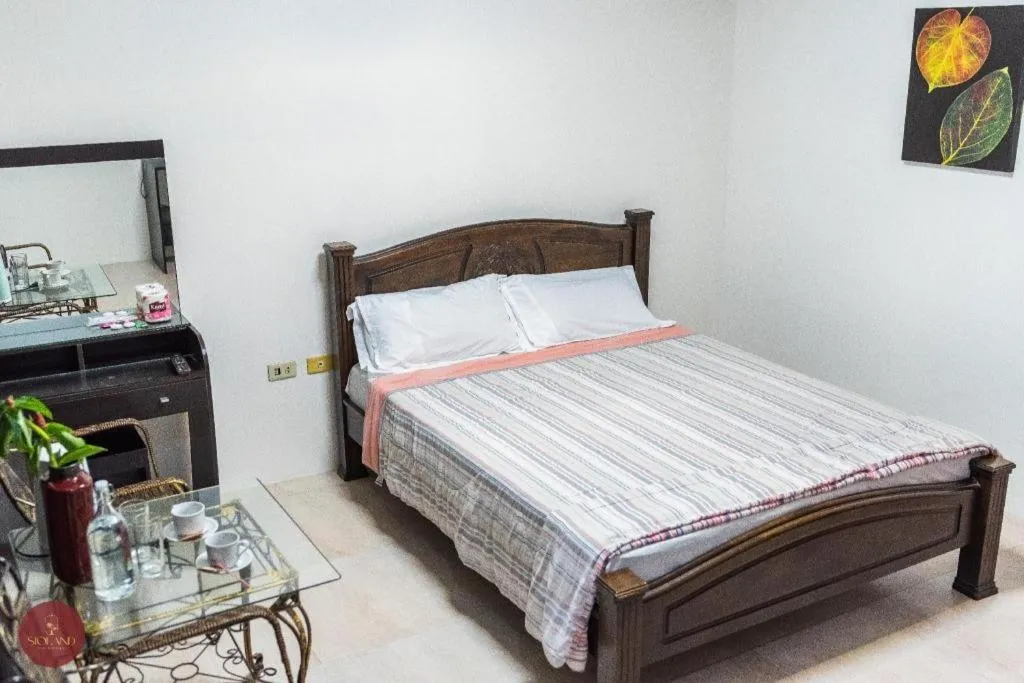 Bed in Quezon Premier Hotel - Candelaria