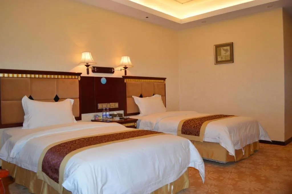 Bed in Shengshi Jinhua Hotel