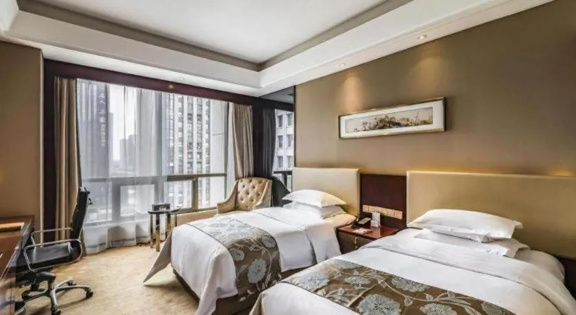 Bed in Zhengzhou Swan City International Hotel