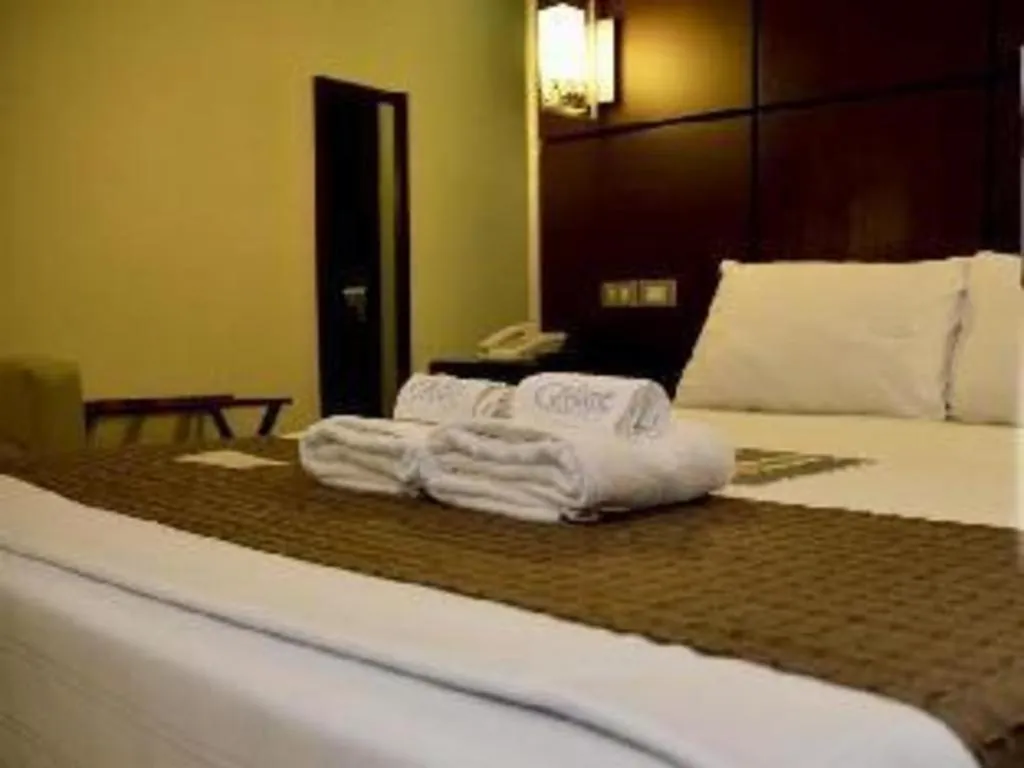 Bed in The Grande Suites