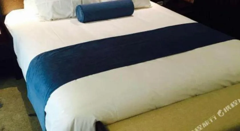 Bed in Ningbo East Shipu Hotel