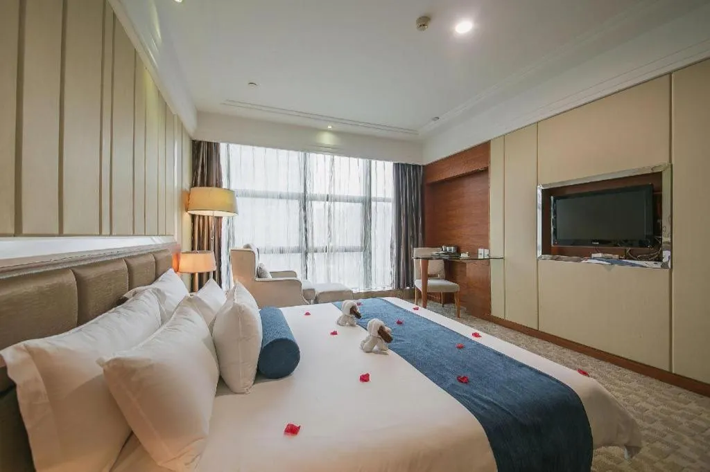Bed in Ningbo East Shipu Hotel
