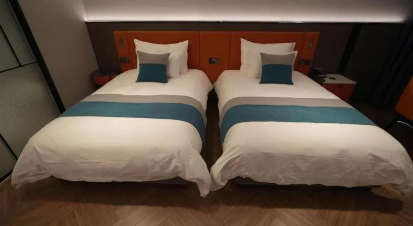 Bed in Ningbo East Shipu Hotel