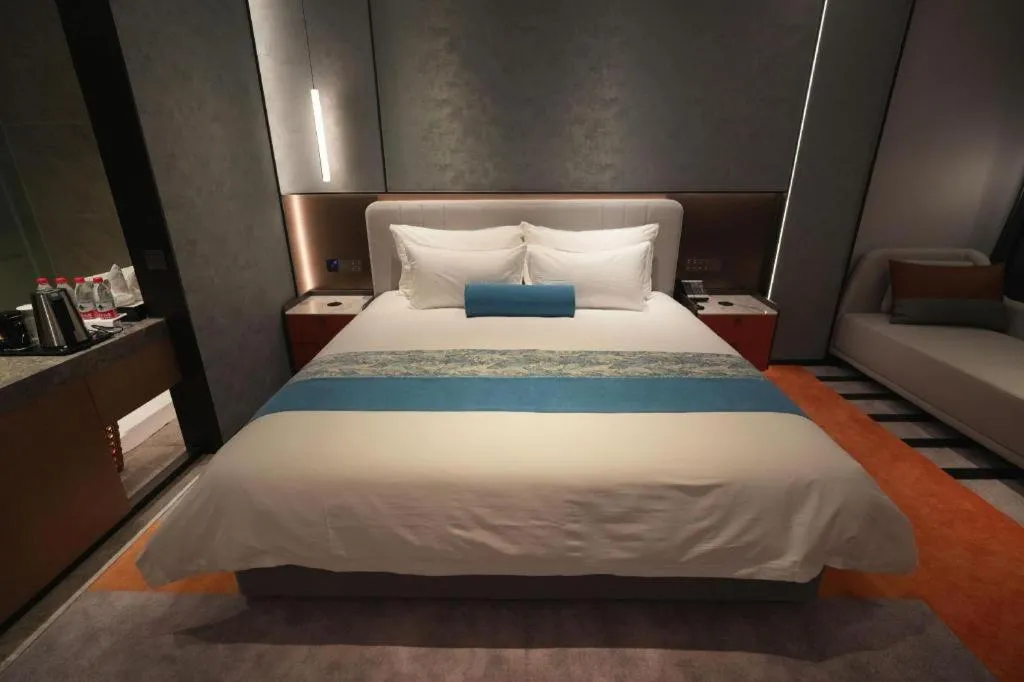 Bed in Ningbo East Shipu Hotel