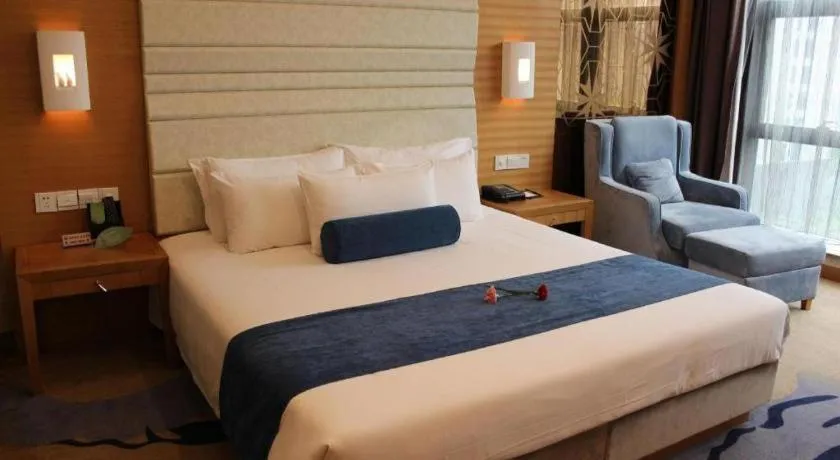 Bed in Ningbo East Shipu Hotel