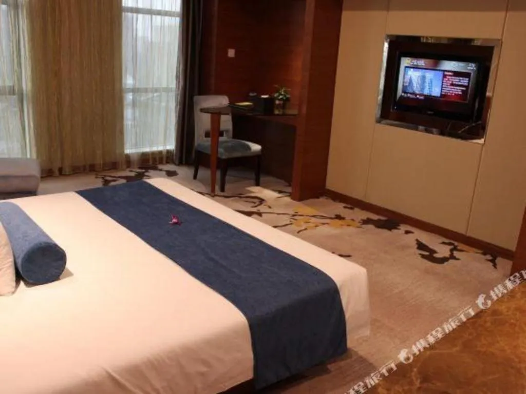 Bed in Ningbo East Shipu Hotel