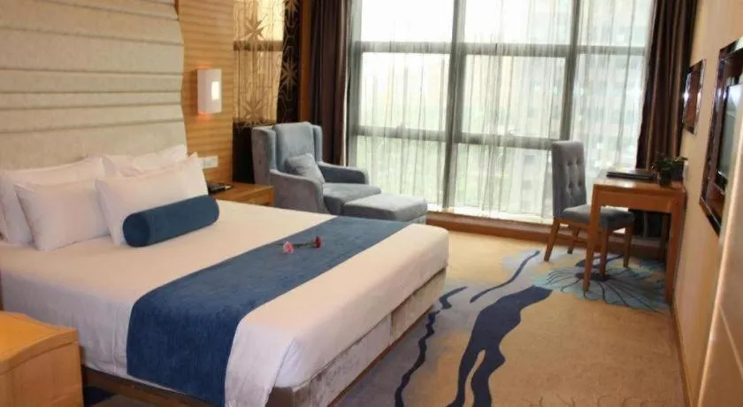 Bed in Ningbo East Shipu Hotel