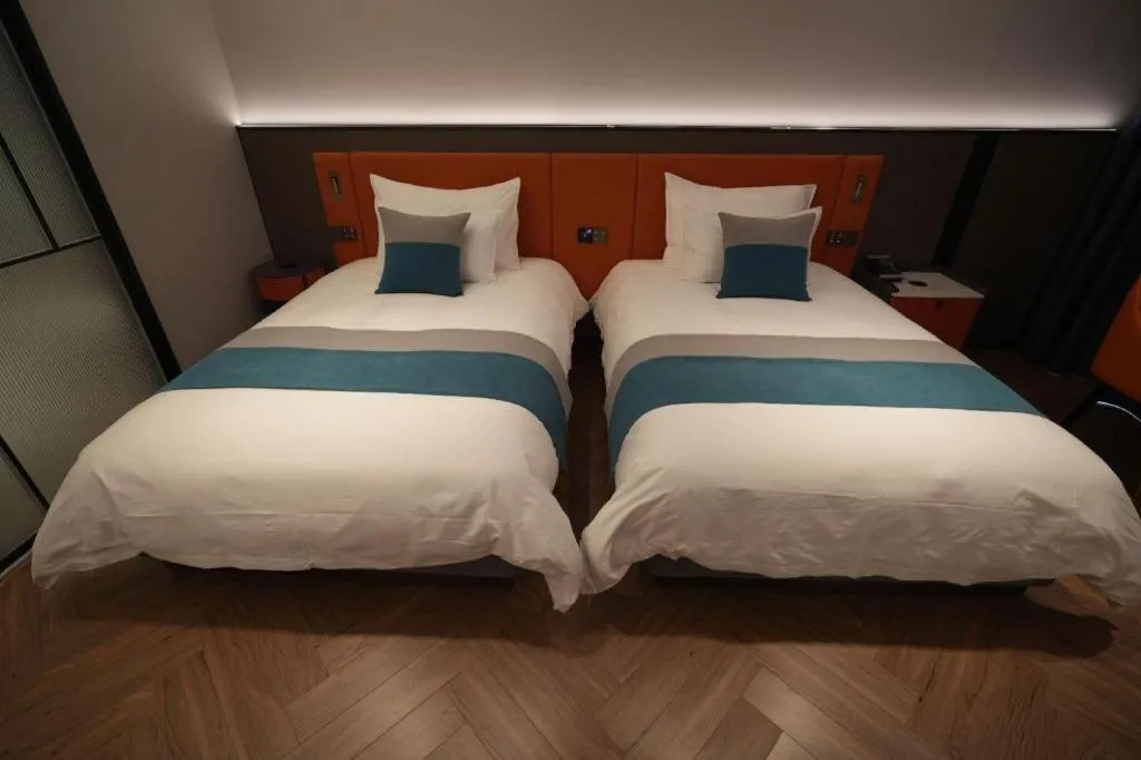 Bed in Ningbo East Shipu Hotel