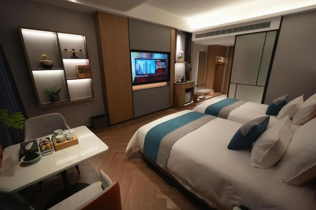 Bed in Ningbo East Shipu Hotel