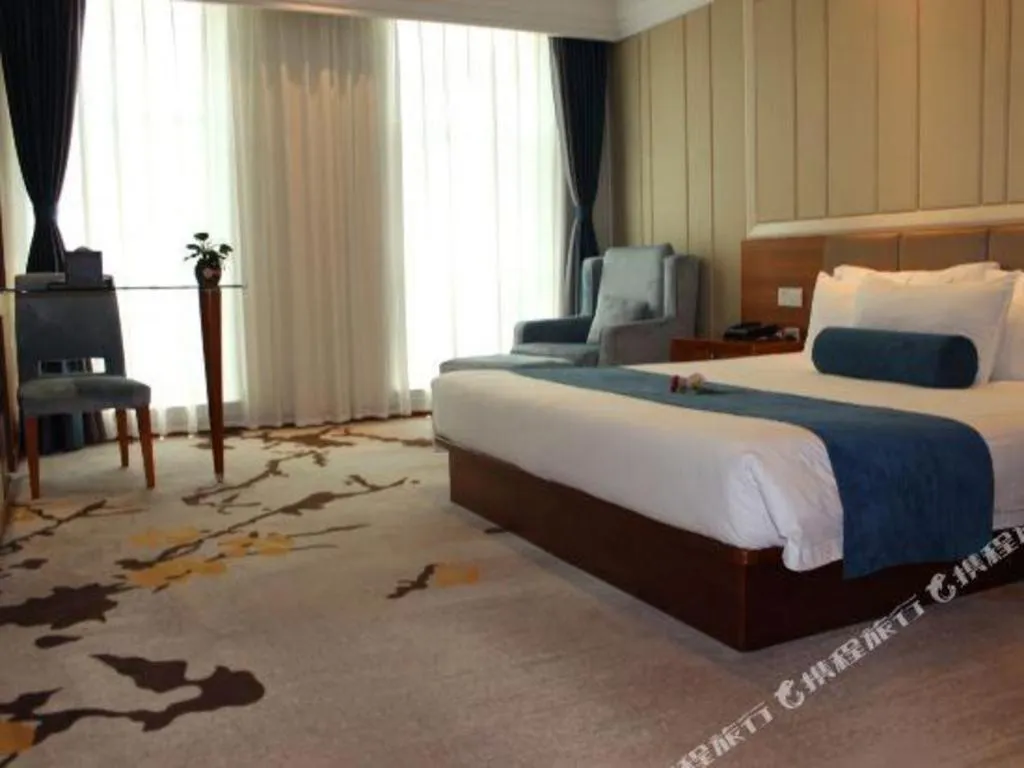 Bed in Ningbo East Shipu Hotel