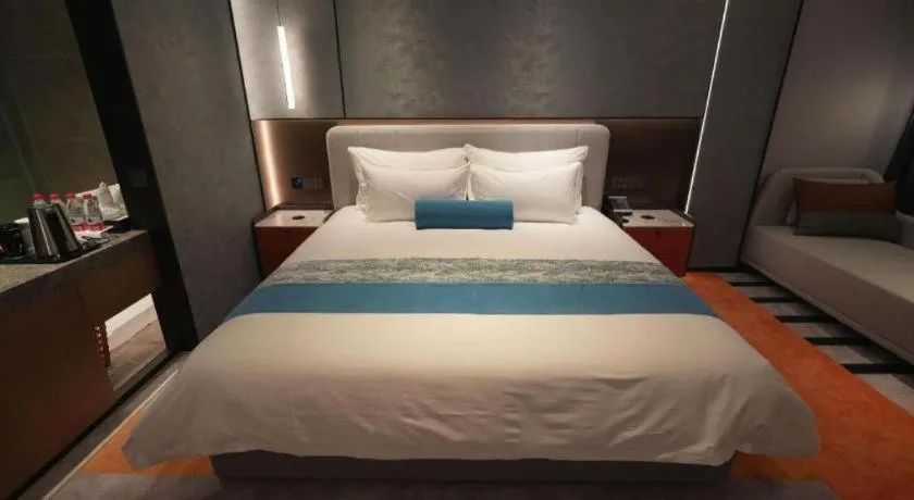 Bed in Ningbo East Shipu Hotel