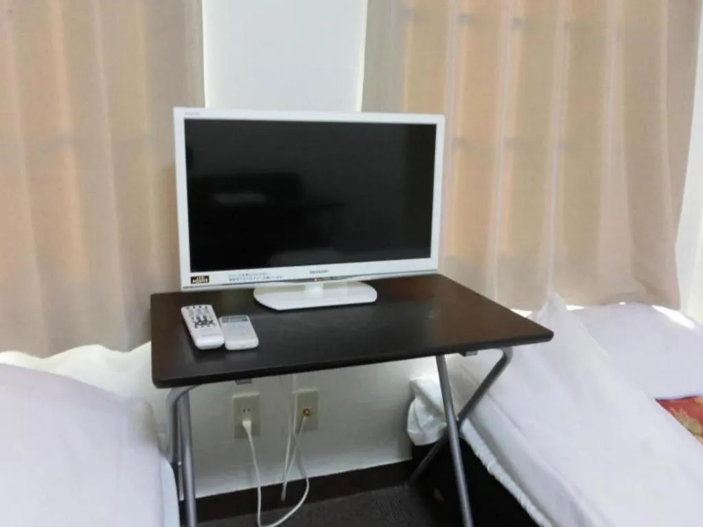 Bed in New Shochikubai Hotel