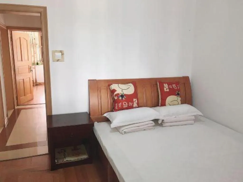 Bed in Weihai Huayu Business Hotel