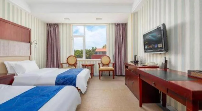 Bed in Weihai Huayu Business Hotel