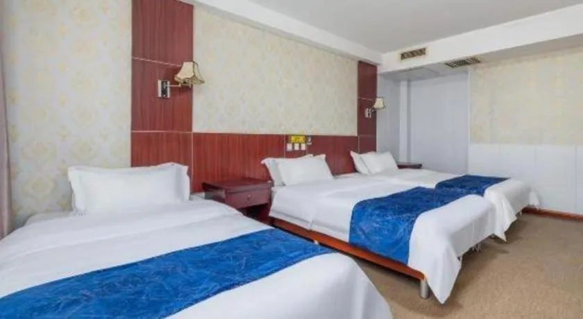 Bed in Weihai Huayu Business Hotel