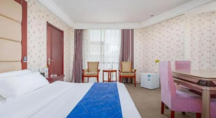 Bed in Weihai Huayu Business Hotel