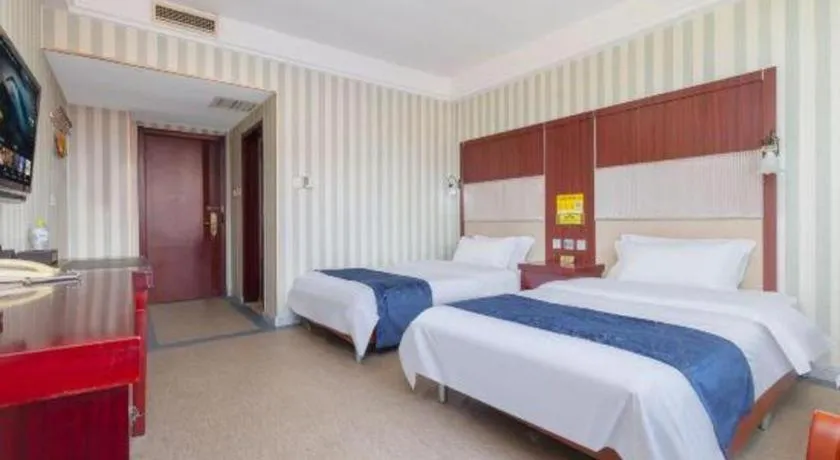 Bed in Weihai Huayu Business Hotel