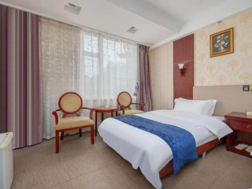 Bed in Weihai Huayu Business Hotel