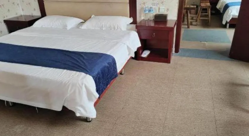 Bed in Weihai Huayu Business Hotel