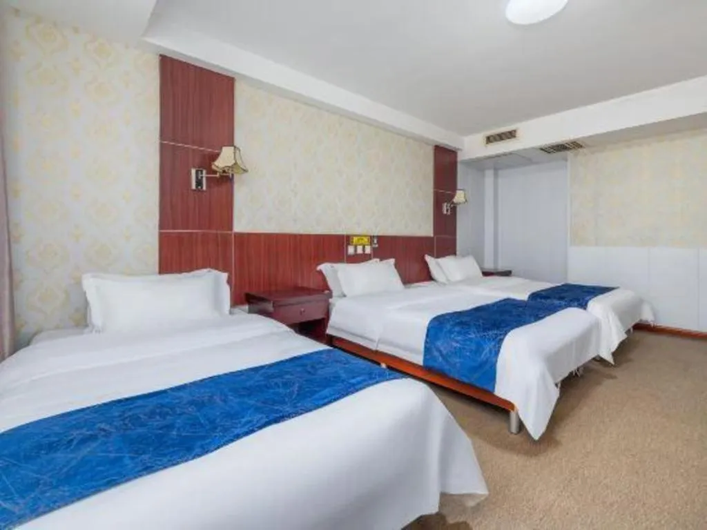Bed in Weihai Huayu Business Hotel