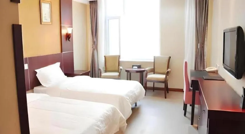 Bed in Weihai Huayu Business Hotel
